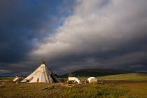 Dark clouds above a Khanty reindeer herder's tent in the Polar Ural Mountains, Yamal, Western Siberia, Russia, Summer 2007.