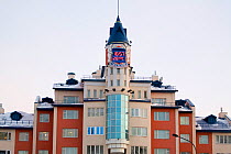 Modern clock tower and apartment block in the centre of Salekhard, the capital of the Yamal. Western Siberia, Russia, August 2008.
