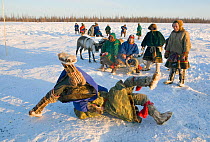 Two Nenets men competing in a wrestling competition at a reindeer herders festival in the Yamal. Western Siberia, Russia, February 2009.
