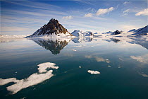 Reflections of glaciers, clouds and mountains in Burgerbukta. Hornsund Fjord, Spitsbergen, Svalbard, Norway, June 2008.