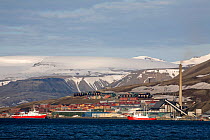 Town of Longyearbyen and the mountains beyond seen from the old coal dock. Spitzbergen, Svalbard, Norway, June 2008.