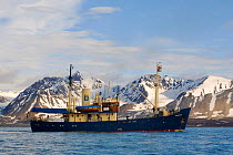 "The Stockholm" with mountains behind, Kongsfjorden, Svalbard, Norway, June 2006.