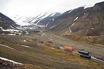 Old residential blocks, now guesthouses, in Nybyen, with the Longyearbyen Glacier beyond. Spitsbergen, Svalbard, Norway, June 2006.
