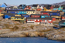 Brightly coloured modern houses close to the sea in Ilulissat, West Greenland, 2008.