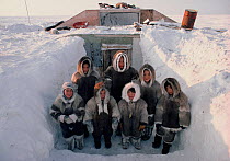 Fur clad Inuit children outside their snow covered home on Baffin Island, Nunavut, Canada, 1987. Editorial use only.