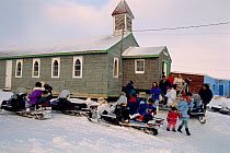 Inuit congregation leaving the Anglican church after sunday service in Igloolik. Nunavut, Canada, 1995.