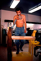 Young Inuit man undergoing fitness testing at the Science Institute's Research Laboratory in Igloolik, Nunavut, Canada, 1990. Editorial use only.