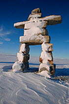 Large Inukshuk built at Igloolik in 2000 to commemorate the new millenium. Nunavut, Canada, 2002.