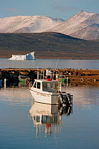 Boat in the harbour of the Inuit community of Qikiqtarjuaq (Broughton Island), Nunavut, Canada, 2002.