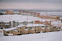 Modern housing units in the Nunavut capital, Iqaluit, on stilts because of the permafrost. Baffin Island, Canada, 2002.