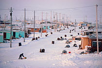 Child in street in the residential area of Inuit settlement Baker Lake, Nunavut, Canada, 1982.