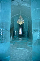 Main hall in the Ice Hotel with chandelier and ice table. Jukkasjarvi, Sweden, 2003.