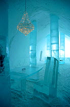 Chandelier hanging above ice table in the Ice Hotel. Jukkasjarvi, Sweden, 2003.