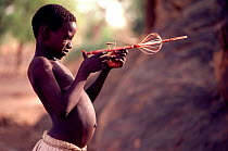 Dogon boy with toy gun. Mali, West Africa, 1981.