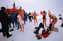 Tourists and Russian crew from icebreaker "Sovetskiy Soyuz" taking part in the 'Polar Plunge' when they reach the North Pole, 1998.