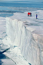 Tourists on tabular iceberg in Tichaja Buchta. Franz Josef Land, Russia, 1998.