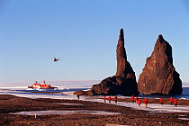 Helicopter transporting tourists from icebreaker at Cape Tegetthoff. Hall Island, Franz Josef Land, 1998.