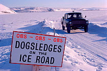 Sign warning of dog sleds on ice road between Thule Air Base and Dundas. Northwest Greenland, 1980.