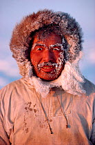 Inuit hunter with frozen hood and beard at minus 30 celsius. Northwest Greenland.