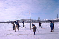 Chukchi men playing traditional lasso game in Chukotka, Siberia, Russia, 1994.