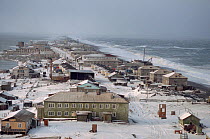 Town of Uelen exposed to heavy seas during autumn storm. Chukotka, Siberia, Russia, 2004.