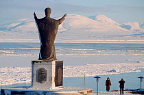 Statue of St Nicholas overlooking harbour in Anadyr. Chukotka, Siberia, Russia, 2004. Editorial use only.