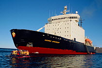 Tourists leaving Russian icebreaker "Kapitan Dranitsyn" on excursion in inflatable boats. Franz Josef Land, Russia, 2004.