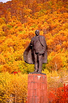 Statue of Lenin in Petropavlovsk, surrounded by autumn colour. Kamchatka, Siberia, Russia, 1999. Editorial use only.