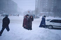 Residents in central Murmansk during winter snow storm. Kola Peninsula, Northwest Russia, 2005.