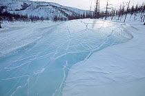 Large 'ice blister,' caused by water pressure, on frozen river in Northern Evensk, Magadan region, Eastern Siberia, Russia, 2006.