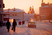 People in the street in centre of Dudinka during winter. Taymyr, Northern Siberia, Russia, 2004.