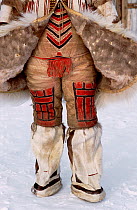 Traditional Nganasan woman's Reindeer / Caribou skin under garment worn with knee length boots. Taymyr, Northern Siberia, Russia, 2004.