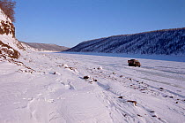 Truck travelling along winter road on the frozen Kotuy River. Taymyr, Northern Siberia, Russia, 2004.