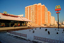 McDonald's restaurant surrounded by apartment blocks in a Moscow suburb, Russia.