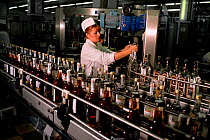 Russian women working on production line in Cristall Vodka Distillery in Moscow, Russia, 2003.
