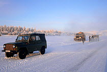 Russian vehicles on the frozen Yana River near Verkhoyansk. Eastern Siberia, Russia, 1999.