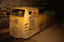 Driver in the cab of an underground train in the October Mine near Norilsk. Western Siberia, Russia, 2000.