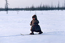 Nenets boy learning to ski. Yamal, Siberia, Russia, 1993.