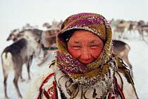 Nenets Reindeer / Caribou herder's wife frosted up after a cold day of travelling. Yamal, Siberia, Russia, 1993.