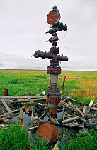 Capped well head and debris left on the tundra in Gazprom's Bovanenkova gas field. Yamal Peninsula, Western Siberia, Russia, 1993.