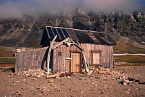 Whale bones leaning against old trapper's hut. Van Keulen Fjord, Spitsbergen, Norway, 1993.