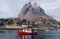 Town of Uummannaq with heart shaped Mountain beyond. Disko Bay, West Greenland, 1997.