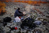Photographer, Vincent Munier, cooking, Forollhogna National Park, Norway, September 2008. On location for Wild Wonders of Europe