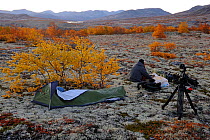 Photographer, Vincent Munier, at campsite, Forollhogna National Park, Norway, September 2008. On location for Wild Wonders of Europe