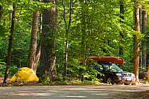 Vehicles at the campground at White Lake State Park in Tamworth, New Hampshire, USA. October 2009