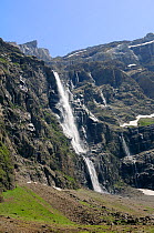 Gavarnie falls cascade down the karst limestone cliffs of the Cirque de Gavarnie, Pyrenees National Park, Haute Pyrenees, France, July 2009