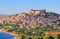 Coastal city of Molyvos (Mithymna) and hilltop medieval Byzantine castle in evening light, Isle of Lesbos / Lesvos, Greece. August 2009