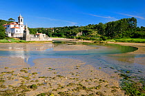Niembro Bay with church and cemetery of Los Dolores at low tide, near Llanes, Asturias, Spain. July 2009