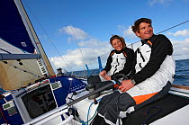 Jeanne Gregoire and Gerald Veniard aboard Figaro yacht "Banque Populaire". Transat AG2R, Port la Foret, Brittany, France. April 2010. Editorial use only.