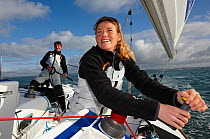 Jeanne Gregoire and Gerald Veniard aboard Figaro yacht ^Banque Populaire^. Transat AG2R, Port la Foret, Brittany, France. April 2010. Editorial use only.